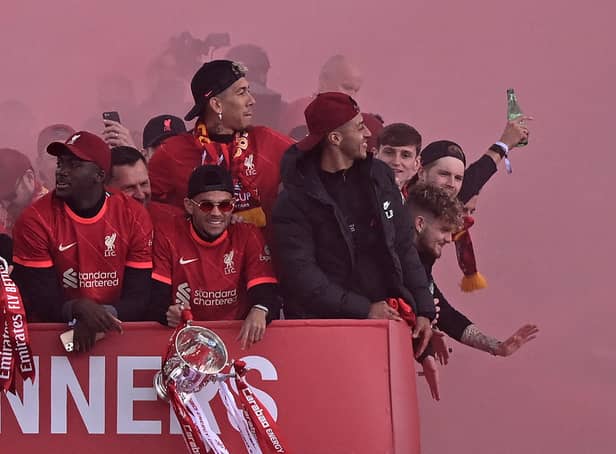 <p>Ibou Konate, left, and Luis Diaz, centre, on Liverpool’s trophy parade. Picture: OLI SCARFF/AFP via Getty Images</p>