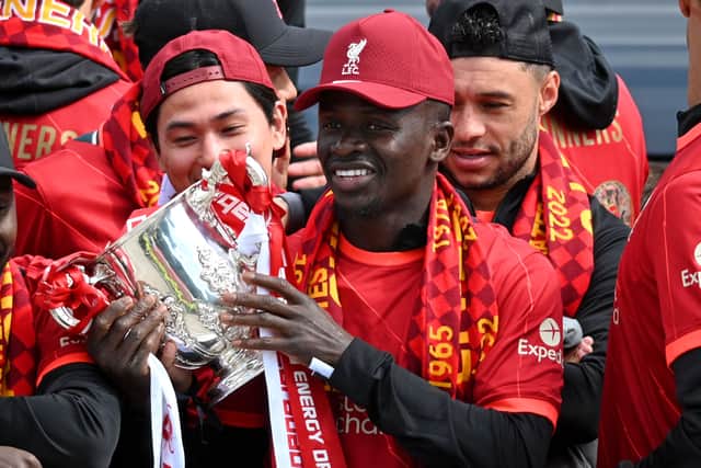 Sadio Mane holds the Carabao Cup during Liverpool’s trophy parade. Picture: OLI SCARFF/AFP via Getty Images