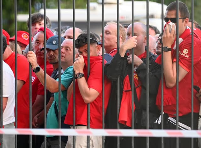  Liverpool fans are seen queuing outside the stadium prior to the UEFA Champions League final match between Liverpool FC and Real Madrid at Stade de France on May 28, 2022 in Paris, France. (Photo by Matthias Hangst/Getty Images)