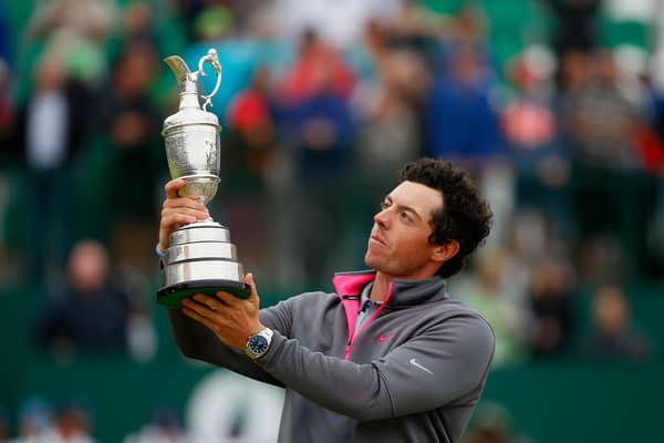 Rory McIlroy lifting the Claret Jug after winning The Open in 2014
