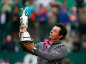 Rory McIlroy lifting the Claret Jug after winning The Open in 2014