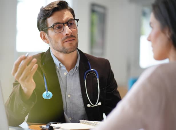 <p>A GP speaks to a patient in an office. Image: goodluz - stock.adobe.com</p>