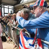 Queen Elizabeth II is greeted by wellwishers after arriving by Royal Train at Liverpool Lime Street Station.
