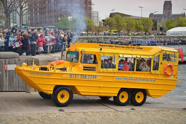 Queen Elizabeth II and Prince Philip, Duke of Edinburgh take a ride on the Yellow Duck and amphibious vehicle during a visit to Merseyside Maritime Museum. The Queen is visiting many parts of Britain as she celebrates her Diamond Jubilee.