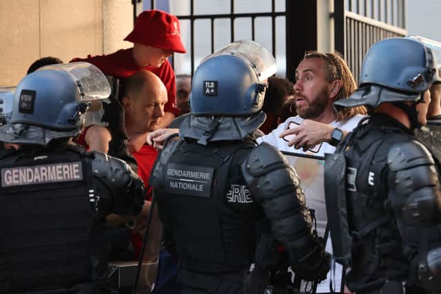 Fans are confronted by Police at the Stade de France. Image: Getty Images