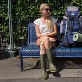 Laura, a doctor from Salisbury, waits for her friends to arrive by train at Castle Cary station for the first day of the 2014 Glastonbury Festival (Photo: Rob Stothard/Getty Images)