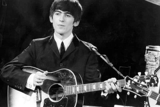Beatles guitarist and singer George Harrison. Image: Fox Photos/Getty Images