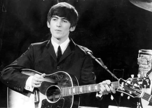Beatles guitarist and singer George Harrison. Image: Fox Photos/Getty Images