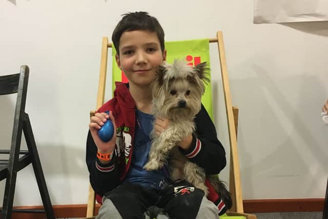 Ten-year-old Misha with Yorkshire Terrier Oscar. 