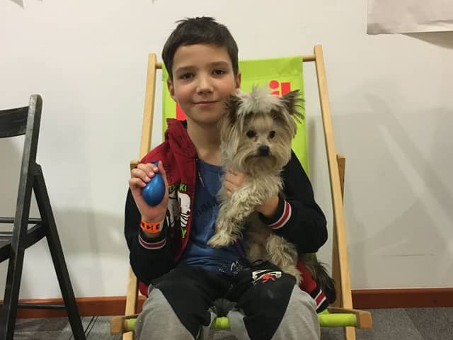 Ten-year-old Misha with Yorkshire Terrier Oscar. 