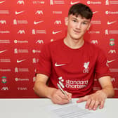 New Liverpool signing Calvin Ramsey signs for the club. Image: Nick Taylor/Liverpool FC/Liverpool FC via Getty Images