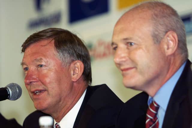 Sir Alex Ferguson alongside Peter Kenyon during a Man Utd press conference. Picture:  Stanley Chou/Getty Images