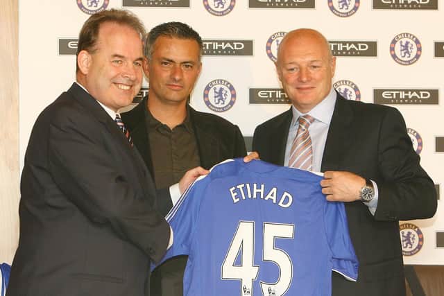 Jose Mourinho, centre, poses with Peter Kenyon, right. Picture: BEN STANSALL/AFP via Getty Images