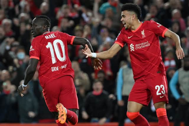 Sadio Mane celebrates with Liverpool’s Luis Diaz. Picture: LLUIS GENE/AFP via Getty Images