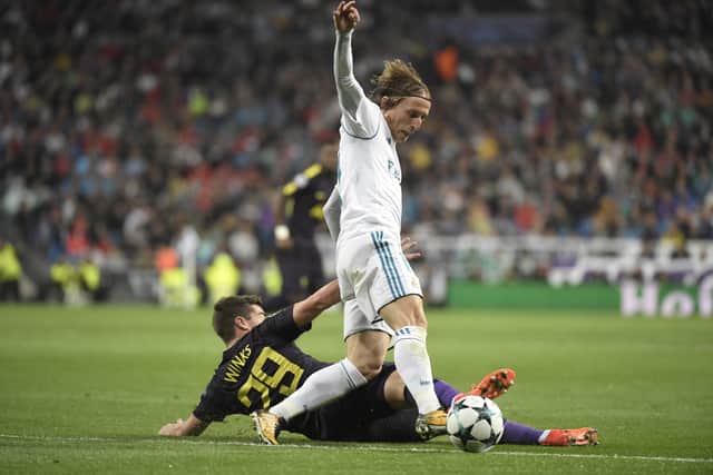 Tottenham’s Harry Winks tackles Real Madrid’s Luka Modric. Picture: GABRIEL BOUYS/AFP via Getty Images