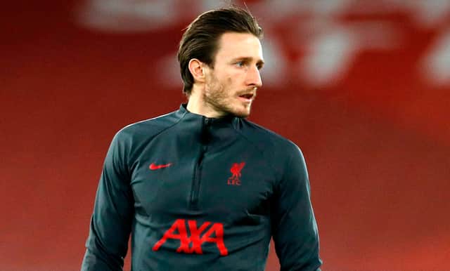 <p>Ben Davies warms up for Liverpool. Picture: PHIL NOBLE/POOL/AFP via Getty Images</p>