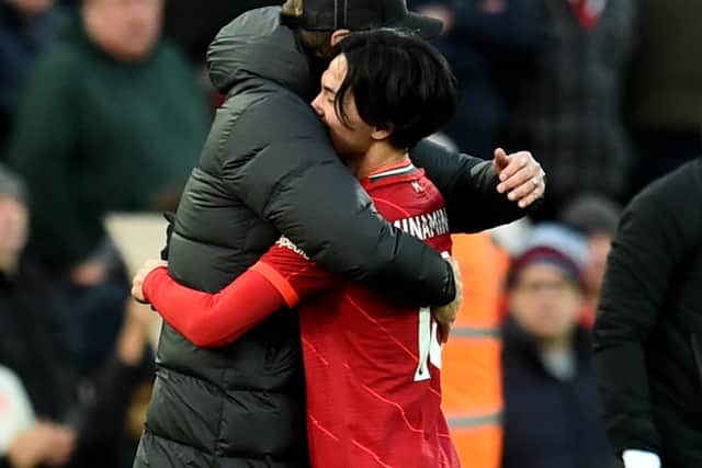 Liverpool manager Jurgen Klopp embraces Takumi Minamino. Picture: Andrew Powell/Liverpool FC via Getty Images