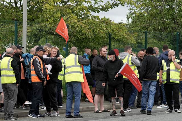 Bus drivers and engineers from Stagecoach Merseyside strike outside the company’s Gilmoss depot. (Photo by Christopher Furlong/Getty Images)