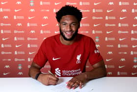 Joe Gomez signs a new Liverpool contract. Picture: Andrew Powell/Liverpool FC via Getty Images