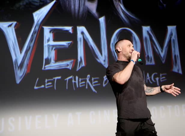<p>Tom Hardy on stage at the fan screening of Venom: Let There Be Carnage. Image: Photo by Tristan Fewings/Getty Images for Sony</p>