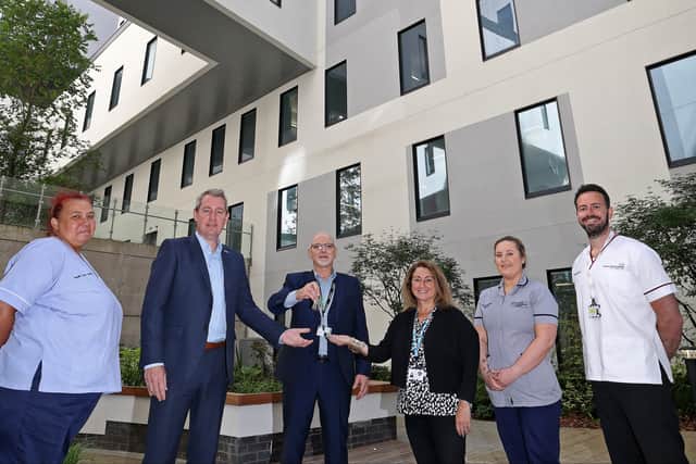 LUHFT CEO James Sumner and Chair Sue Musson are handed keys to the new Royal Liverpool University Hospital. Photo: LUHFT