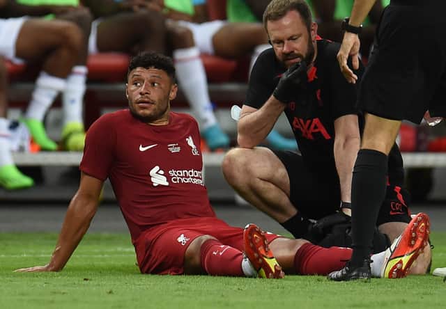 Alex Oxlade-Chamberlain down injured. Picture: John Powell/Liverpool FC via Getty Images