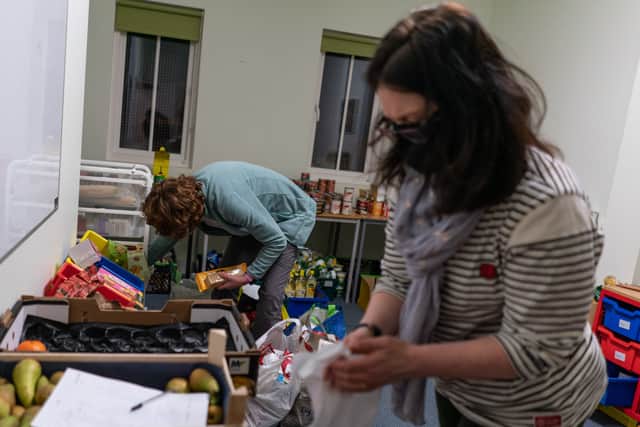 Volunteers are seen packing food parcels at a food bank. Photo:  Peter Summers/Getty Images