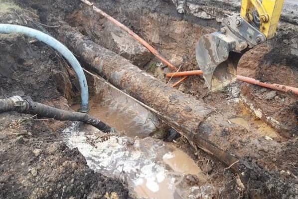 Engineers work to fix the burst water pipe in Church Road. Image: United Utilities