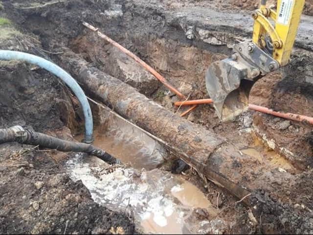 <p>Engineers work to fix the burst water pipe in Church Road. Image: United Utilities</p>