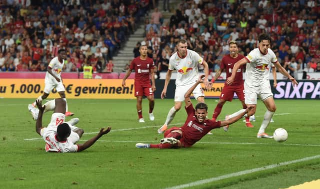 Luis Diaz goes down inside the box during Liverpool’s loss to RB Salzburg. Picture: John Powell/Liverpool FC via Getty Images