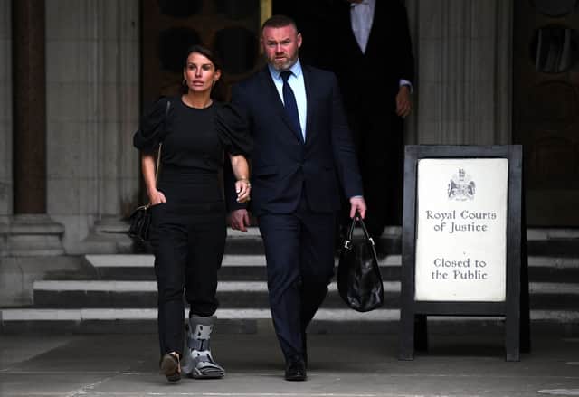 Coleen Rooney and her husband former England footballer Wayne Rooney, leave from the High Court