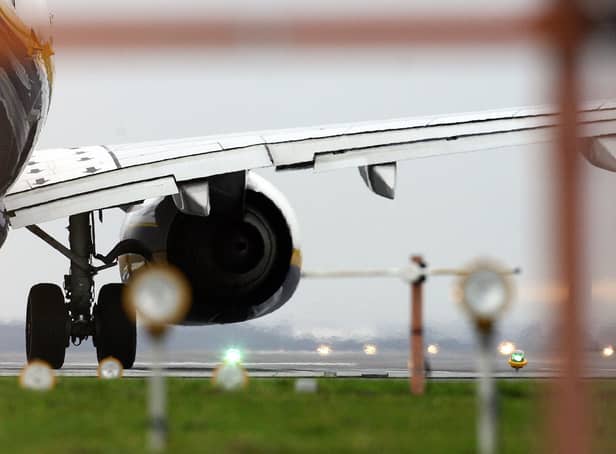 <p>The engine of a Ryanair aeroplane is seen as it waits for take off at Liverpool John Lennon Airport,</p>