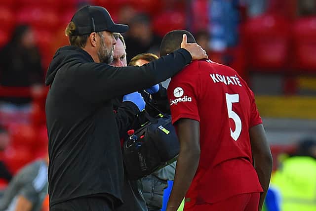 urgen Klopp manager of Liverpool with Ibrahima Konate of Liverpool as he is taken off injured in action during the Pre-Season Friendly between  Liverpool v RC Strasbourg at Anfield on July 31, 2022 in Liverpool, England. (Photo by John Powell/Liverpool FC via Getty Images)