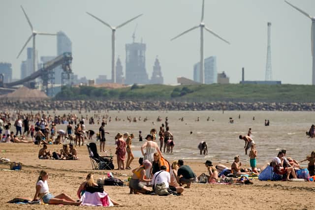People enjoying the warm weather on Crosby Beach during the 2020 heatwave. Is there more to come for Liverpudlians?