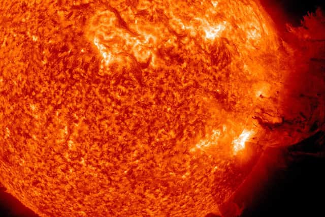 Space telescopes capturing the moment a solar flare erupted in 2011. A large cloud of particles flew up and then was pulled back down to the sun's surface