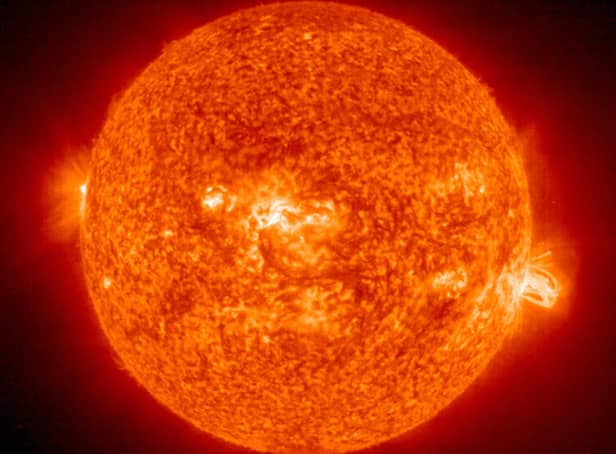 <p>his 19 August, 2004 NASA Solar and Heliospheric Administration (SOHO) image shows a solar flare(R) erupting from giant sunspot 649</p>