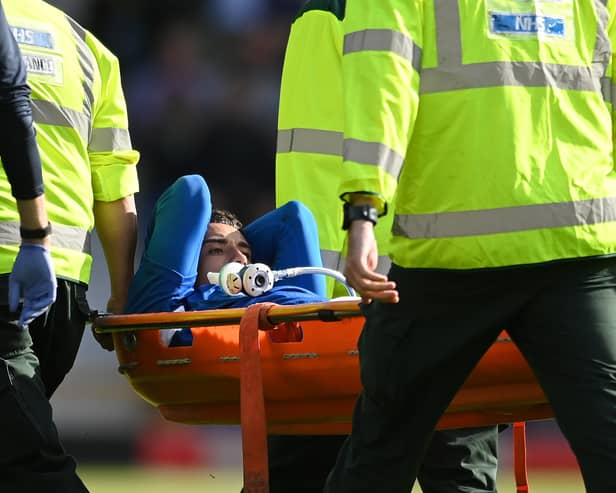 LIVERPOOL, ENGLAND - AUGUST 06: Ben Godfrey of Everton is stretchered off the pitch after receiving medical treatment during the Premier League match between Everton FC and Chelsea FC at Goodison Park on August 06, 2022 in Liverpool, England. (Photo by Michael Regan/Getty Images)