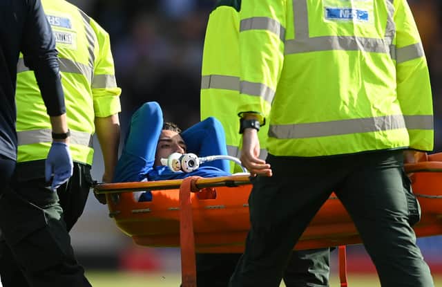 <p>LIVERPOOL, ENGLAND - AUGUST 06: Ben Godfrey of Everton is stretchered off the pitch after receiving medical treatment during the Premier League match between Everton FC and Chelsea FC at Goodison Park on August 06, 2022 in Liverpool, England. (Photo by Michael Regan/Getty Images)</p>
