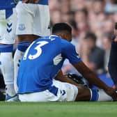 Yerry Mina receives treatment during Everton’s loss to Chelsea. PIcture: Catherine Ivill/Getty Images