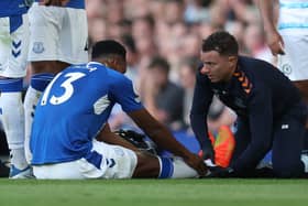 Yerry Mina receives treatment during Everton’s loss to Chelsea. PIcture: Catherine Ivill/Getty Images