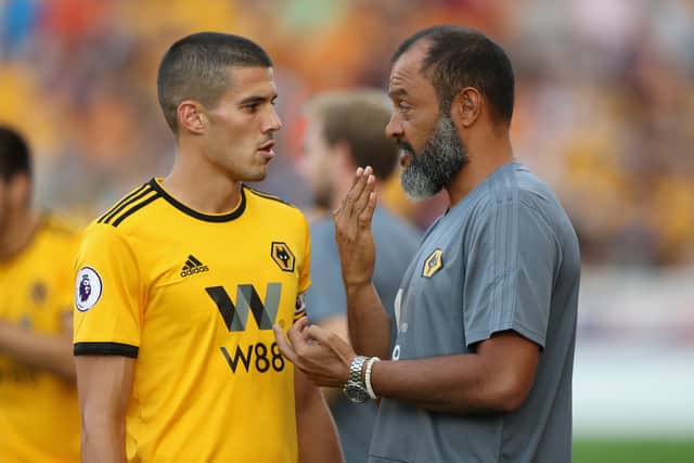 Former Wolves boss Nuno Espirito Sancho speaks with Conor Coady. Picture:  David Rogers/Getty Images