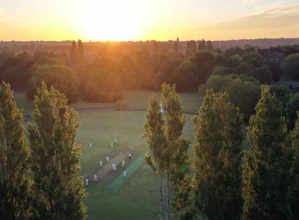 <p>An aerial view shows the sun rising for the Solstice Cricket Match between teams from the Sefton Park Cricket Club in Liverpool</p>