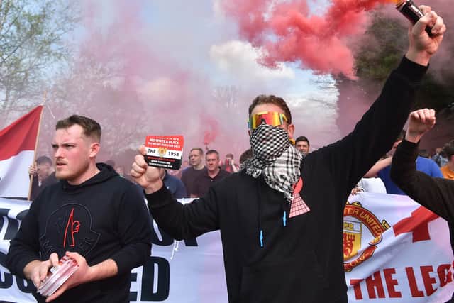 Manchester United fans take part in a protest outside the stadium. Photo: Nathan Stirk/Getty Images