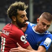Everton defender Vitalii Mykolenko battles Liverpool’s Mo Salah. Picture: Andrew Powell/Liverpool FC via Getty Images