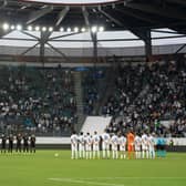 Zurich’s and Arsenal’s players line up during a minute of silence in their Europa League fixture on Thursday following the announcement of the death of Britain’s Queen Elizabeth II. Credit: URS BUCHER/AFP via Getty Images