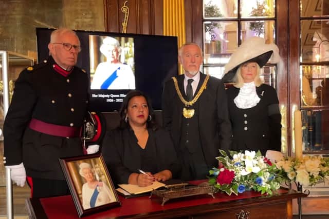 Liverpool’s civic leaders sign the book of condolence for the Queen