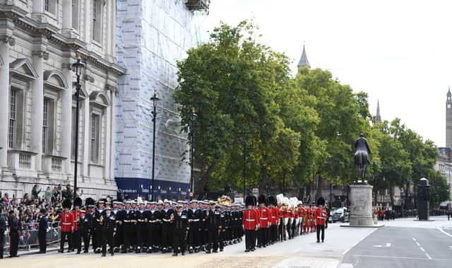 The Queen's funeral cortege borne on the State Gun Carriage of the Royal Navy travels along Whitehall following the State Funeral of Queen Elizabeth II at Westminster Abbey
