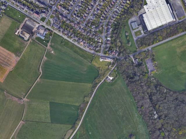 Land where 240 homes could be built on green land near Greasby. The plans have been highly controversial with local residents. Credit: Google Maps.