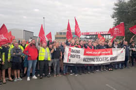 Liverpool dock workers on strike in a dispute over pay