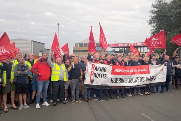 Liverpool dock workers on strike in a dispute over pay